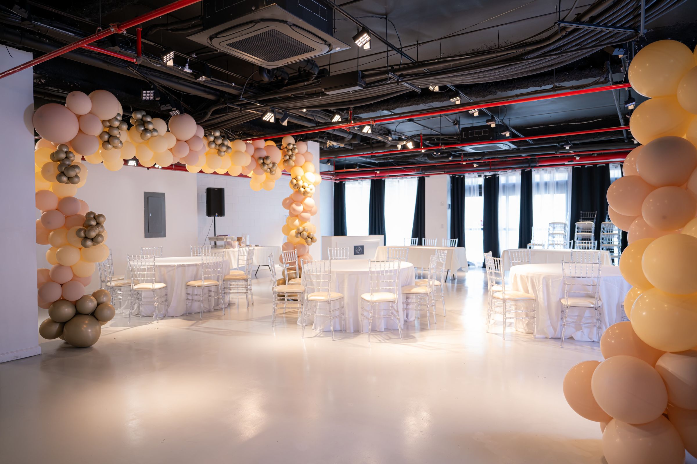 Modern industrial all white canvass with exposed ceilings — event space in Williamsburg