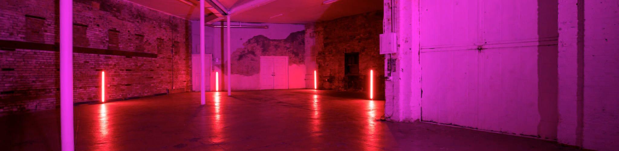 Industrial Warehouse with TV Wall, stage, and bar in Bushwick, Brooklyn — event space in Stuyvesant Heights